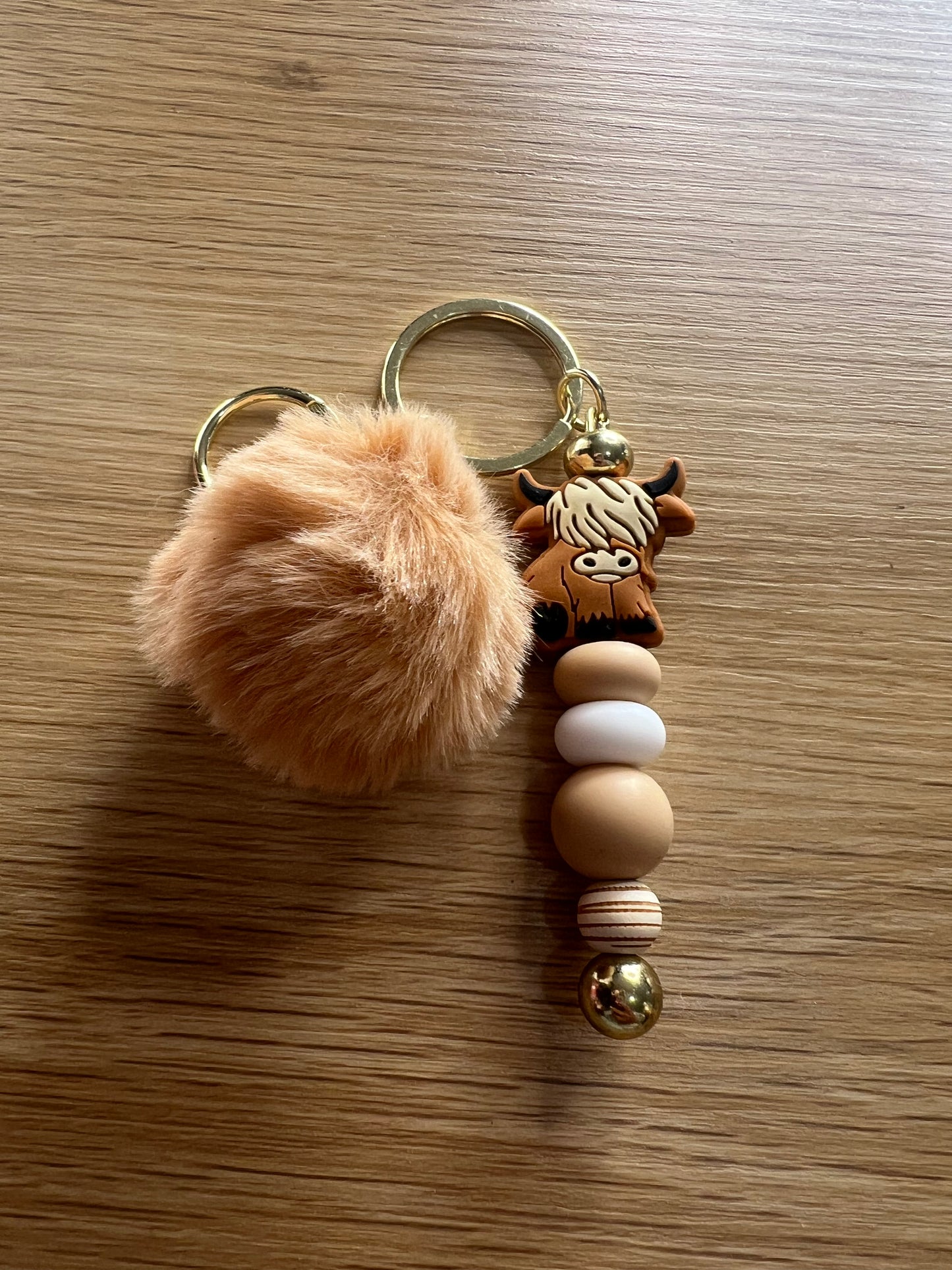 Brown hyland pompom