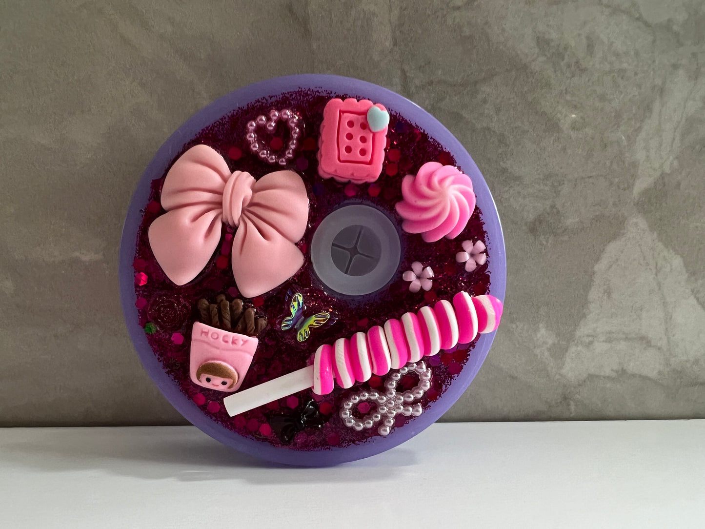 Purple lid with pink bows and lollies