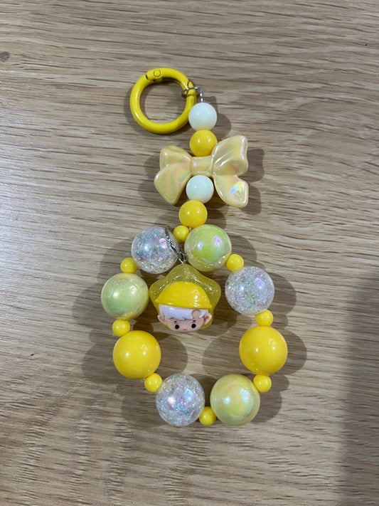 Yellow boy and bow keychain